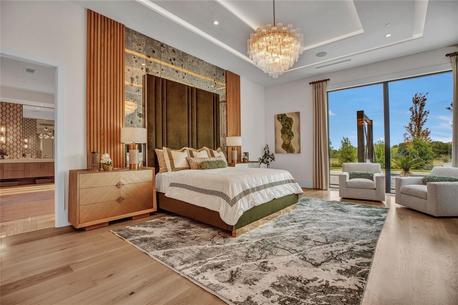 Bedroom with green velvet headboard
